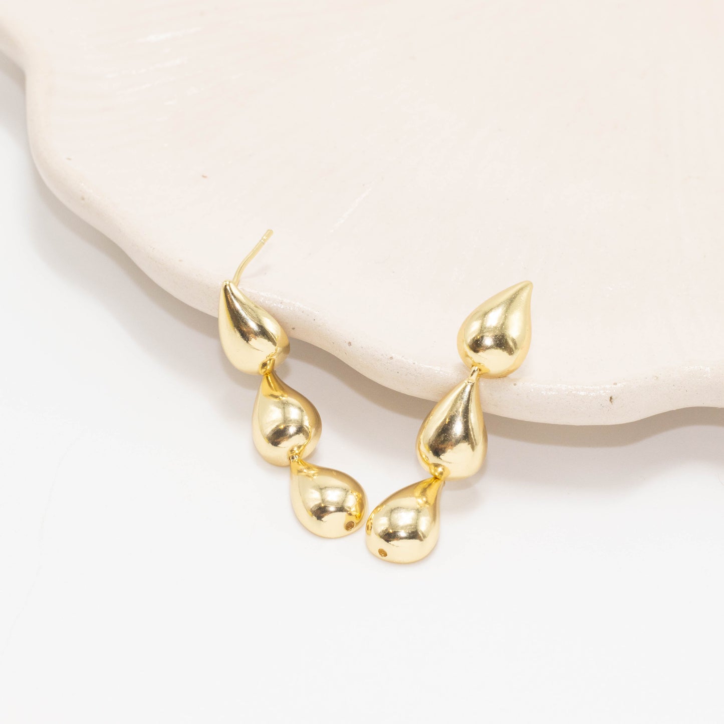 Arete gotas dijes