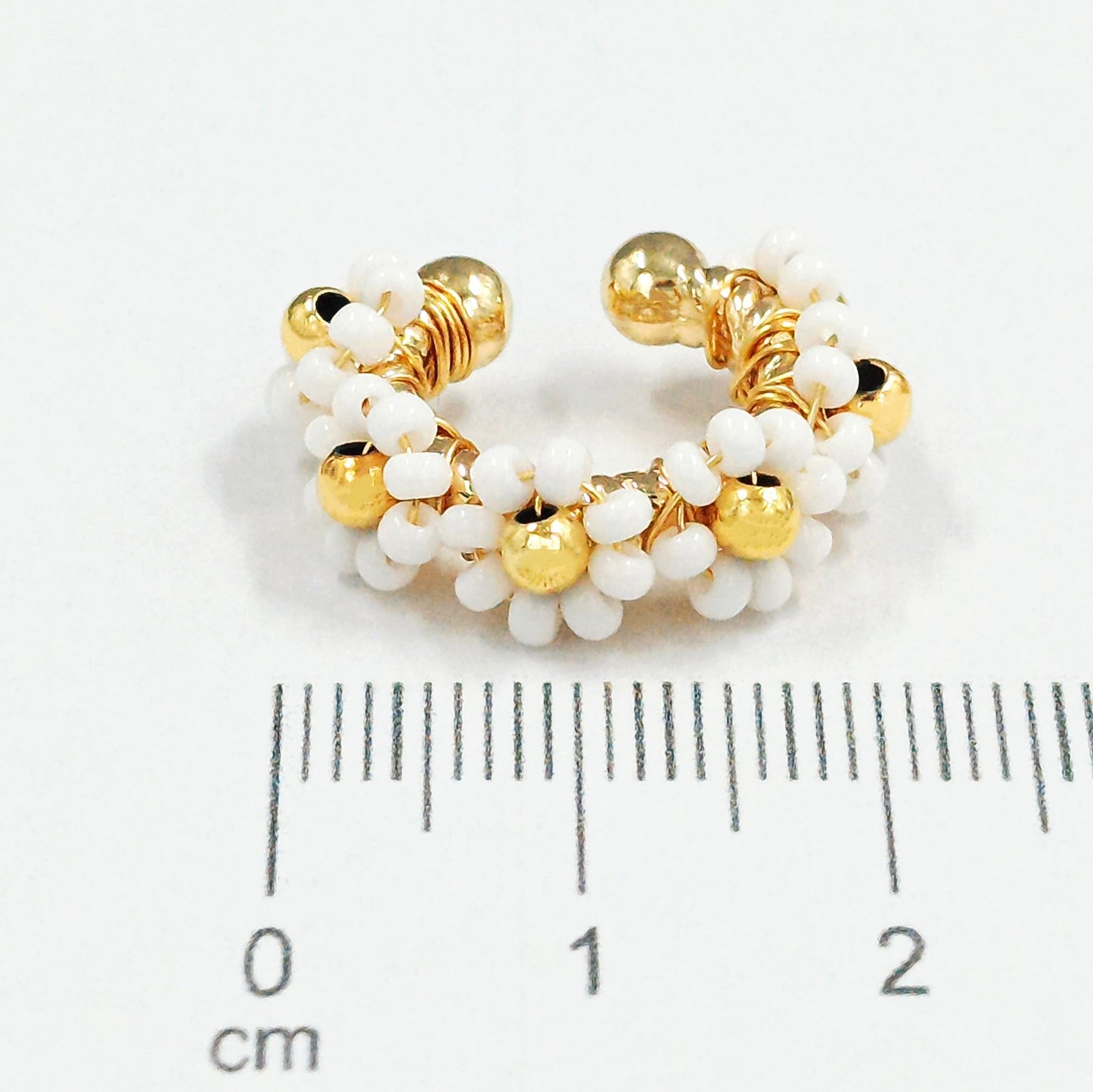 Earcuff bronce flor blanco