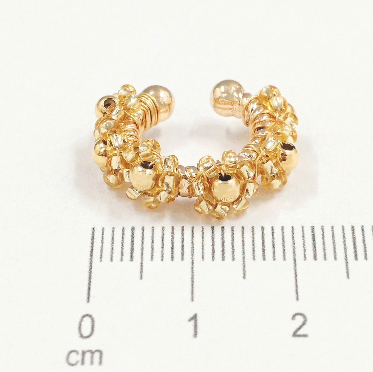 Earcuff bronce flor dorada