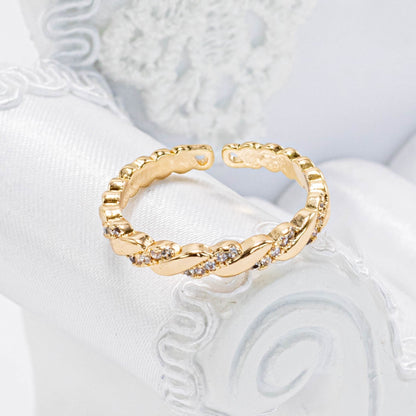 Anillo trenza microzircones