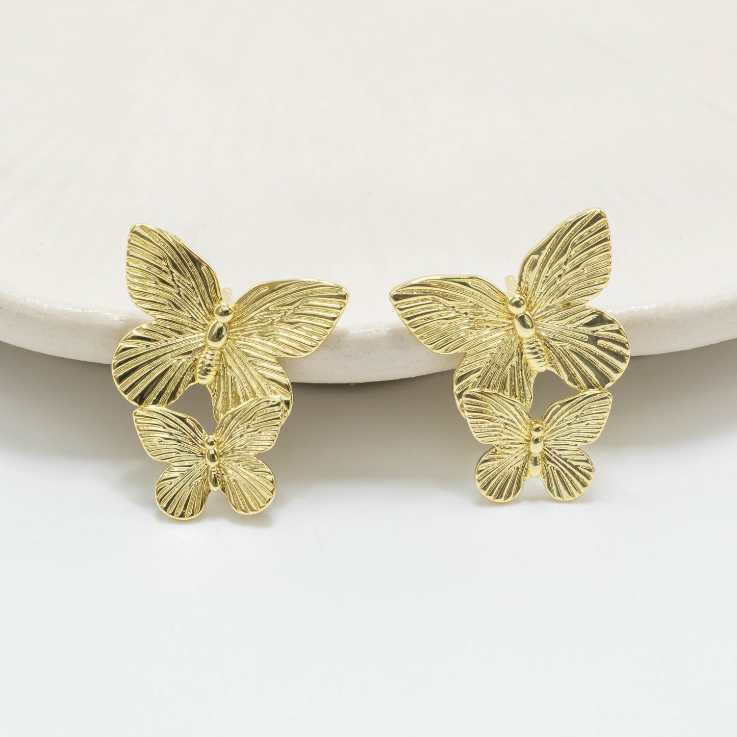 Arete dos mariposas