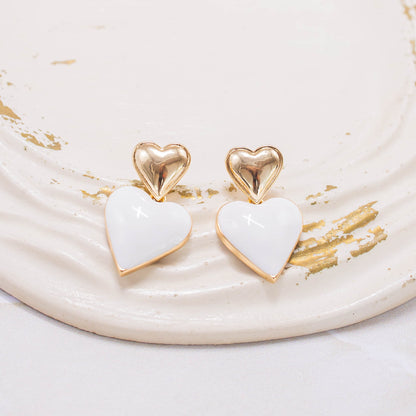 Arete corazón blanco