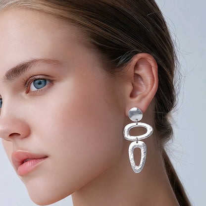 Arete figuras baño de plata