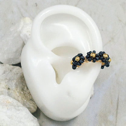 Earcuff bronce flor black Amulí