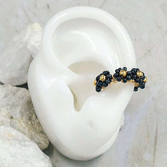 Earcuff bronce flor black Amulí