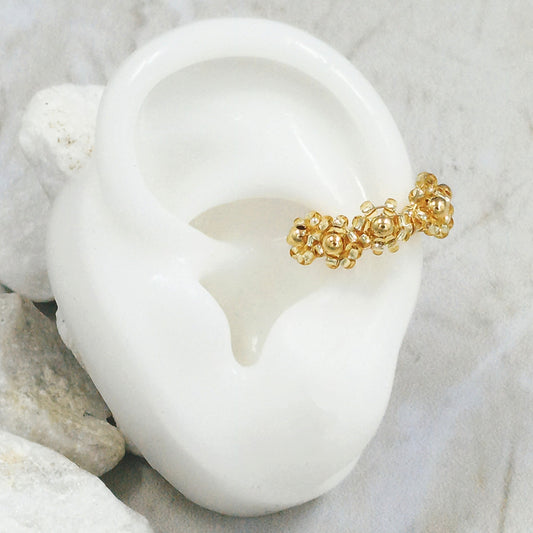 Earcuff bronce flor dorada Amulí