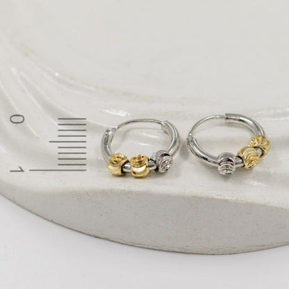 Candonga pequeña dije balines dos oros (1cm)