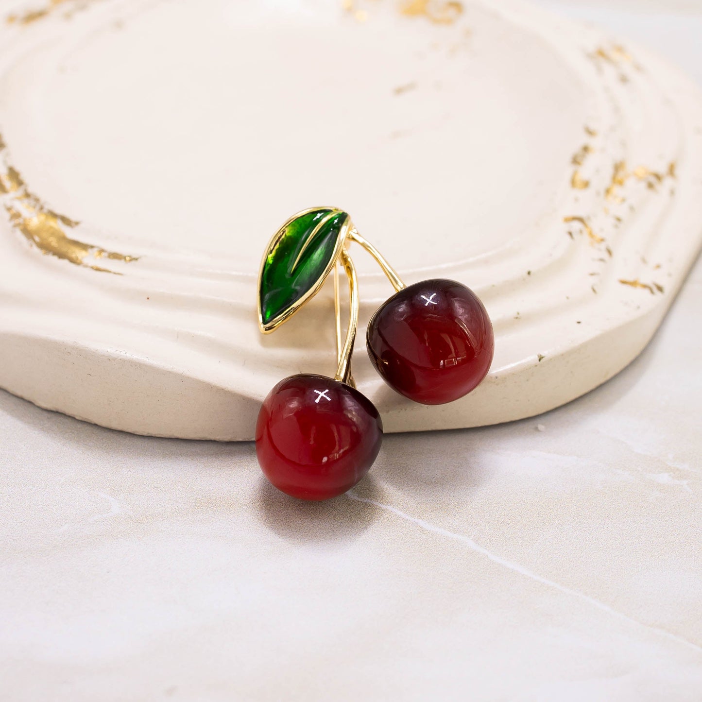 Broche cereza doble