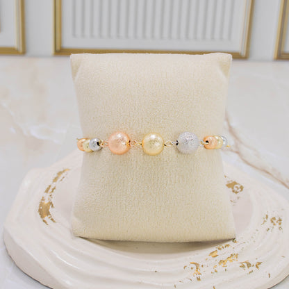Pulsera balín fusco 3 oros